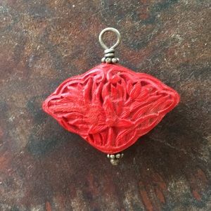 Carved red pendant
